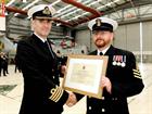 POAET Jack Malcolm receives his Commendation from Capt Adrian Orchard OBE