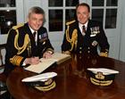 The new First Sea Lord Admiral Sir Philip Jones (left) and his predecessor Admiral Sir George Zambel