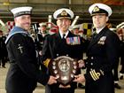 R Admiral Blount OBE, presents the Australia Shield to Cdr Brendan Spoors and LAET John Simpole of 8