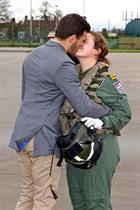Lt Laura Cambrook is welcomed home by Husband Tom Lindsey at RNAS Yeovilton