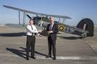 Rear Admiral Martin Connell CBE (left) hands over the Royal Navy's historic aircraft collection to C